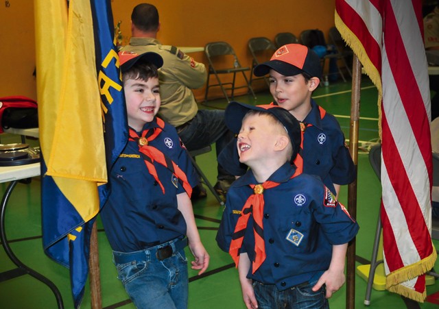 Tiger Cubs Mason McMillan, age 7 (left), Kade Dressing, age 6 (center), and Evan Zawojski, age 7, prepare for the closing ceremony in the aftermath of the Pack 69 Pinewood Derby held Jan. 23 at Vogelweh Elementary School.