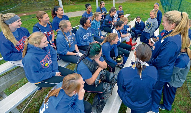 Photo by Staff Sgt. Sharida Jackson Members of the University of Notre Dame softball team answer questions from the Ramstein High School Royals varsity softball team Oct. 21, 2015, on Ramstein. Notre Dame softball team members visited Ramstein during their 10-day European tour. The tour included softball instructional clinics in which Notre Dame players helped the high school players with offensive and defensive softball skills.