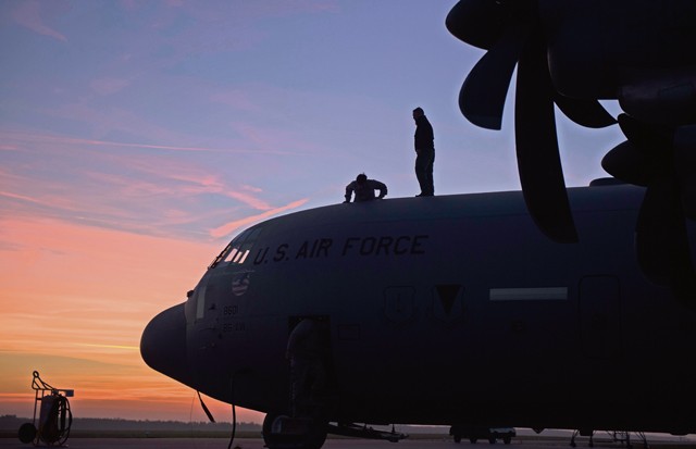 Photo by Senior Airman Damon Kasberg Members of the 86th Aircraft Maintenance Squadron enter a C-130J Super Hercules after performing repairs to a wing during Aviation Detachment 16-1 Oct. 27, 2015, on Powidz Air Base, Poland. Units from the 86th Airlift Wing flew to Poland to take part in the flying training deployment and support the 37th Airlift Squadron as they completed training requirements.