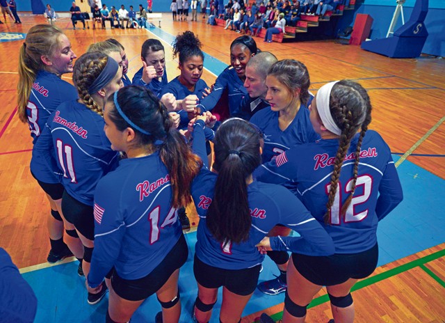 Photo by Staff Sgt. Sharida Jackson Members of the Ramstein Royals volleyball team huddle before their match during the Department of Defense Dependents Schools European volleyball championships Nov. 7, 2015, on Ramstein. Ramstein was one of 26 teams from three divisions competing in the DODDS European volleyball championships. 