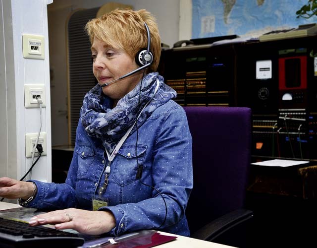 Christel Piscione, 86th Communications Squadron consolidated switchboard operator, answers and connects a call Jan. 4 on Ramstein. Piscione speaks English, German, Italian and a little French, which helps her assist people of different nationalities.
