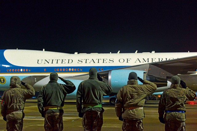 Photo by Senior Airman Nicole Sikorski U.S. Air Force leaders salute as Air Force One departs Ramstein Jan. 27, 2015. The President of the United States made a brief stop at Ramstein for refueling before heading back to the states.