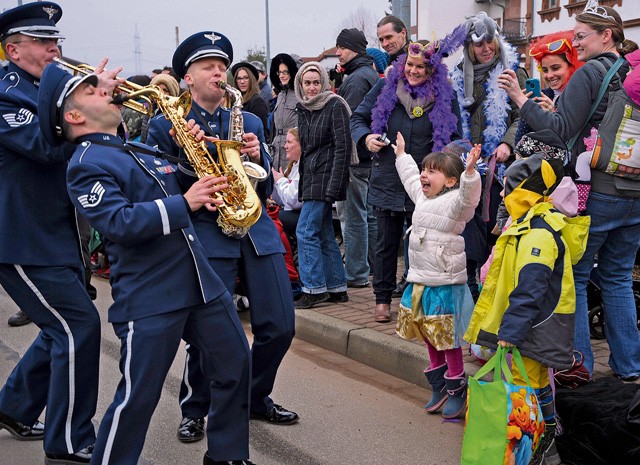 Photo by Senior Airman Timothy Moore Members of the U.S. Air Forces in Europe Band interact with the crowd during the Fasching parade Feb. 17, 2015, in Ramstein-Miesenbach. The USAFE Band and approximately 1,400 other participants marched in the parade for more than two hours entertaining the local crowd.