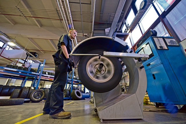 Photo by Senior Airman Nicole Sikorski Airman 1st Class Austin Conway, 86th Vehicle Readiness Squadron general purpose light vehicle mechanic, checks the pressure in a tire Jan. 14, 2015, on Ramstein. The 86th VRS is responsible for servicing more than 1,000 vehicles on and off base.