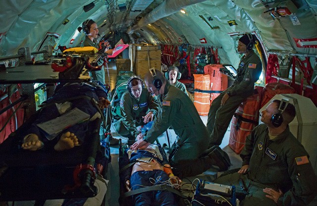 Photo by Senior Airman Damon Kasberg Airmen of the 86th Aeromedical Evacuation Squadron perform lifesaving procedures to a mock patient in a KC-135 Stratotanker March 26, 2015, on Ramstein. Aircrew and a KC-135 from Royal Air Force Mildenhall, England, spent multiple days on Ramstein performing aerial refueling missions, which also gave AES Airmen the opportunity to train on their mission inside a different airframe.