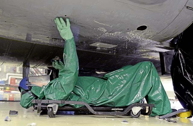 Capt. Rachel Weiler, 86th Maintenance Squadron maintenance flight commander, washes the underbelly of a Ramstein C-130J Super Hercules Jan. 4 on Ramstein. The wash was performed before the aircraft’s C-2 isochronal inspection.