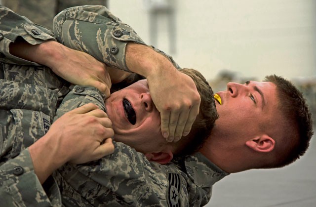 Staff Sgt. Mark Kegel, 435th Security Forces Squadron patrolman, spars with Staff Sgt. Jacob Udell, 65th SFS flight chief from Lajes Field, Portugal, during a security forces combative course Jan. 14 on Ramstein.