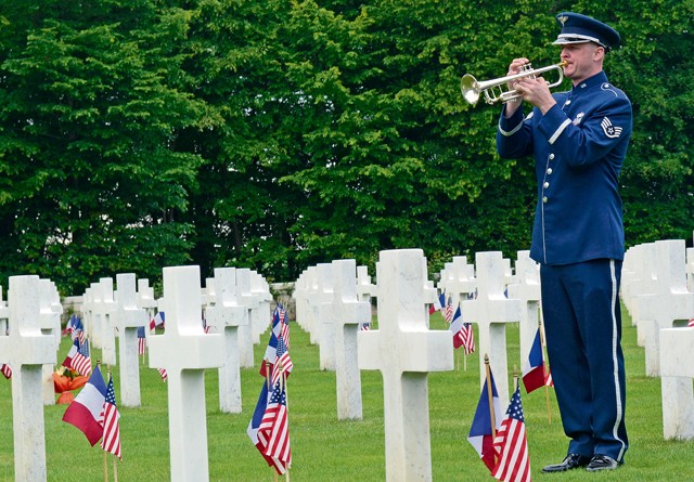 Photo by Airman 1st Class Tryphena Mayhugh A bugler from the U.S. Air Forces in Europe Band plays taps during a Memorial Day ceremony May 24, 2015, at St. Mihiel American Cemetery in Thiaucourt, France. More than 4,100 U.S. military members from World War I are buried in the cemetery where local community leaders gathered with U.S. Air Forces in Europe service members to honor the fallen to commemorate Memorial Day.