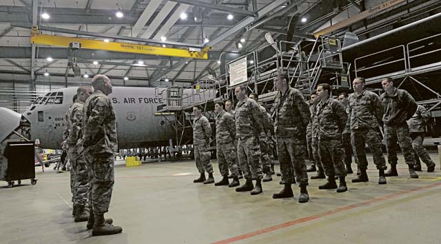 Airmen from the 86th Maintenance Squadron isochronal inspection section stand in for the morning roll call Jan. 7 on Ramstein. The 86th MXS ISO inspection team was preparing to begin the day’s portion of a C-2 ISO inspection. A C-2 ISO inspection can take approximately two weeks to complete, depending on the maintenance required.