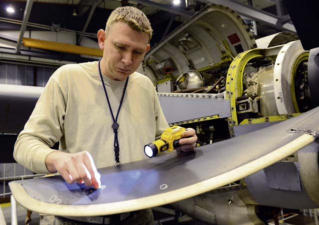 Staff Sgt. Joshua Stites, 86th Maintenance Squadron aerospace propulsion journeyman, marks damaged areas on a C-130J Super Hercules propeller Jan. 7 on Ramstein. Stites was marking damaged areas as part of a C-2 isochronal inspection of the aircraft.