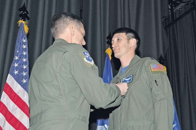Capt. Kenneth Jubb, 37th Airlift Squadron flight commander, receives the Air Medal pinned by Lt. Gen. Timothy Ray, 3rd Air Force and 17th Expeditionary Air Force commander, Feb. 19 on Ramstein. Jubb received the prestigious award for demonstrating exemplary airmanship and professionalism to safely recover an aircraft during an emergency ramp-open landing. 