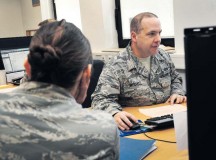 Tech. Sgt. David Mitchell, 786th Civil Engineer Squadron payments and construction equipment NCO in charge, assists Senior Airman Kathryn Patchoski, 569th U.S. Forces Police Squadron police services NCO, with her tax return at the tax center Feb. 18 on Ramstein. The tax center assisted in returning $2.1 million in refunds to their KMC customers in 2014.