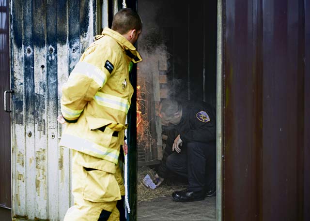 Firefighters from the 65th Civil Engineer Squadron start a structural fire at their training facility Feb. 6 on Lajes Field, Azores, Portugal. The training was designed to prepare newly hired Portuguese locals.