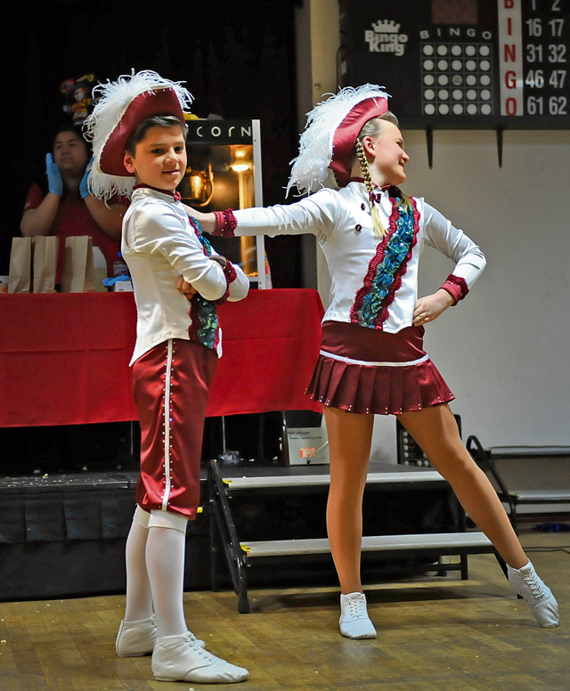 Mareike Schaumloeffel and Maris Schuler, a “Tanzpaar,” “dance couple,” perform a dance during a kinder Fasching celebration Jan. 25 on Ramstein. Dance teams performed routines for a crowd to boost morale and excitement for upcoming Fasching parades.