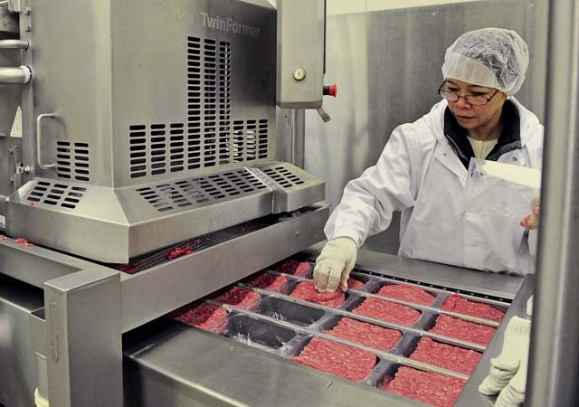 Teresa George, Defense Commissary Agency employee, quality controls ground beef at the Ramstein Central Meat Processing Plant Jan. 25 on Ramstein. The Ramstein CMPP consolidated with the plants in Rhein-Main, Germany, and Lakenheath, England, on March 16, 1998, and is the only meat processing plant in the Department of Defense.