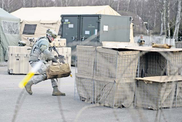 Senior Airman Zachery Davis, 1st Combat Communications Squadron electrical power production technician, positions himself to counter a mock opposition forces attack Feb. 12 on Ramstein. The 1st CBCS trains Airmen in a variety of scenarios as they may deploy to any part of the European and African theaters.