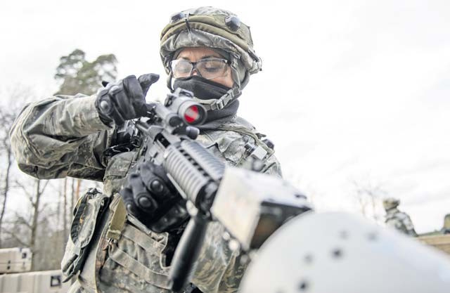 Staff Sgt. Yvonne Solorio, 1st Combat Communications Squadron client system technician, clears her weapon after a mock firefight Feb. 12 on Ramstein. The Airmen worked in shifts to guard and provide a quick response force to ensure the operations at their training base continued uninterrupted. 