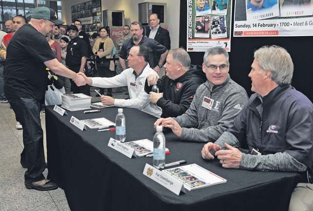 Football coaches meet fans during the 2016 Coaches Tour Feb. 14 on Ramstein. The coaches who attended the tour are Troy Calhoun, Air Force Academy head coach; Chip Kelly, San Francisco 49ers head coach; Chris Creighton, Eastern Michigan University head coach; and Patrick Steenberge, Global Football founder. 