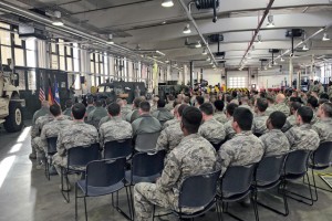 Airmen and family members listen as Col. Lawrence Hicks, 86th Logistics Readiness Group commander, speaks during a Homefront Heroes ceremony Feb. 19 on Ramstein. Hicks spoke about his appreciation to the deployed members and their families for their strength and commitment.