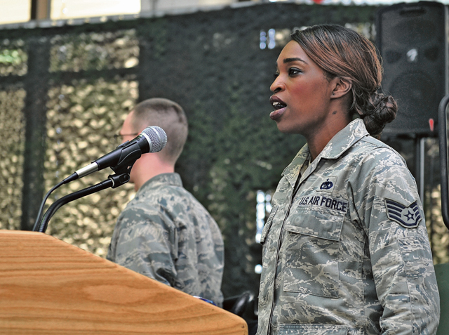 Staff Sgt. Kennesha Key, 86th Vehicle Readiness Squadron fleet management and analysis NCO, sings both the U.S. and German national anthems during a Homefront Heroes ceremony Feb. 19 on Ramstein. The event is the first of its kind on Ramstein and focuses on honoring the dedication and hard work of families during deployments.