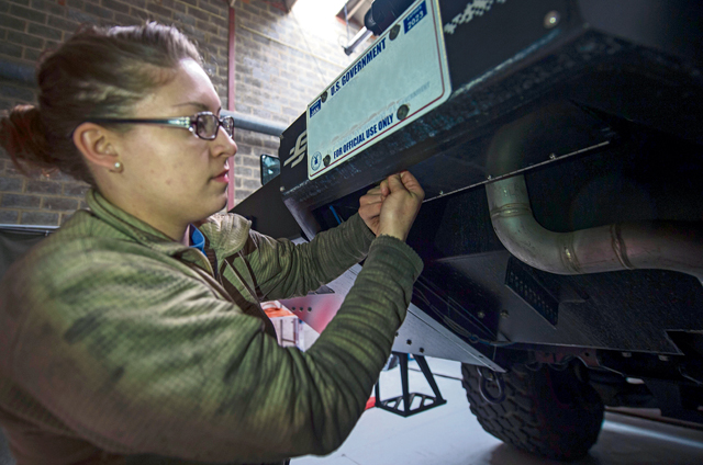 Senior Airman Nicole Franklin, 424th Air Base Squadron special vehicle mechanic, inspects the no-foam system on a Striker 1500 firetruck Feb. 26 on Chievres Air Base, Belgium.
