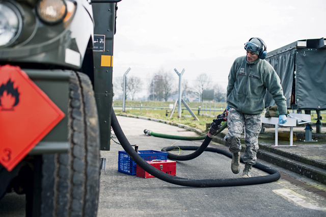 Senior Airman Julian Ortiz-Serrano, 424th Air Base Squadron fuels management technician, stows a hose after refilling a fuel truck Feb. 25 on Chievres Air Base, Belgium. Romero is one of 70 Airmen assigned to the 424th ABS.