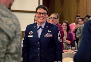 Photo by Staff Sgt. Sara KellerChief Master Sgt. Amber Mitchell, former U.S. Air Forces in Europe’s Kisling NCO Academy commandant, smiles as the crowd applauds her after her speech during a luncheon held in honor of Women’s History Month March 25, 2015, on Ramstein.