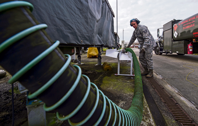 Tech. Sgt. Marcus Romero, 424th Air Base Squadron fuels management technician, stows a hose after refilling a fuel truck Feb. 25 on Chievres Air Base, Belgium.
