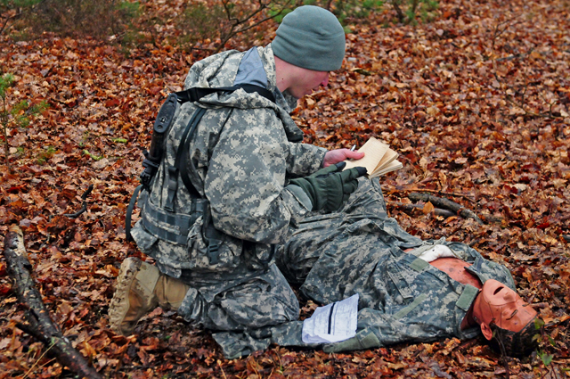 A competitor administers first aid to a simulated casualty during the 266th Financial Management Center’s Best Warrior Competition March 2 on Rhine Ordnance Barracks.