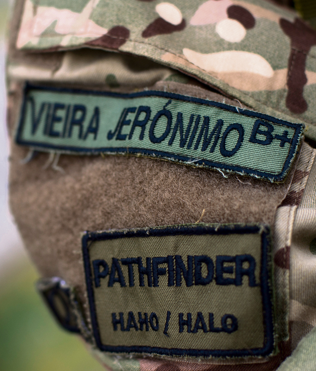 Patches of a Portuguese paratrooper are worn as he prepares for a high-altitude, low-opening jump during exercise Real Thaw 16 Feb. 24 in Beja, Portugal.