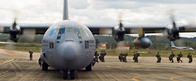 Portuguese paratroopers load onto a Royal Netherlands Air Force C-130H Hercules during exercise Real Thaw 16 Feb. 25 in Beja, Portugal. Royal Netherlands air force worked alongside the U.S. to airdrop more than 100 paratroopers.