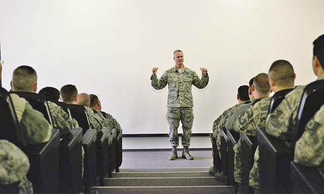 Col. Charles Henderson, 521st Air Mobility Operations Wing vice commander, speaks in front of a crowd of Airmen during the Air Force Assistance Fund kickoff March 21 on Ramstein. Henderson, alongside other base leaders, came to start the campaign by talking to Airmen about the importance of the program and how it can help those in need.