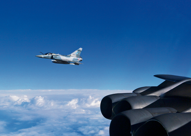 Photo courtesy of the U.S. Air ForceA French Mirage 2000 flies off the wing of a U.S. Air Force B-52 Stratofortress March 1 in the skies over northern France. Several B-52s participated in French-led close air support exercise Serpentex for the first time this year, joining forces from a dozen nations to train and develop better tactics, techniques and procedures.