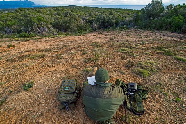 Master Bombardier Mathiew Marcoux-Desrochers, a joint terminal attack controller from the Yankee Battery of the 2nd Regiment, Royal Canadian Horse Artillery, verifies coordinates on a map as part of training during exercise Serpentex 16 March 7 in Corsica, France.
