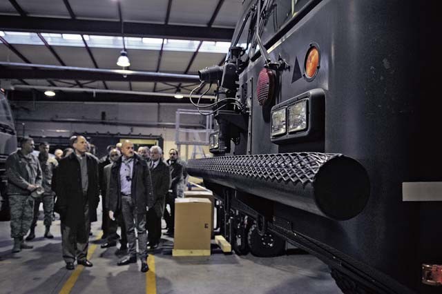 Lt. Gen. Lee K. Levy II, Air Force Sustainment Center commander (front left), tours the Central Regional Storage Facility site March 3 at Sanem, Luxembourg. The CRSF site stores Air Force equipment, such as government vehicles, fuel tanks and basic equipment airfield requirement kits. 