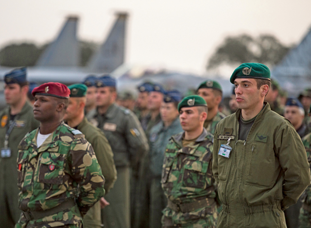 Allied service members wait for the opening ceremony to begin for exercise Real Thaw Feb. 21 in Beja, Portugal. Real Thaw 16 is a Portuguese-hosted NATO exercise that provides tactical training to multiple participating nations. Its aim is to merge and employ different aerial platforms towards one major objective, covering a vast range of activities to include defensive and offensive counterair operations, high-value air assets protection and slow-mover protection. Nations participating this year include the U.S., Portugal, Belgium, Denmark, France, the Netherlands, Norway and Spain.