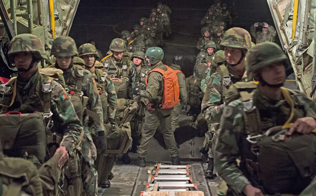 Approximately 70 Portuguese paratroopers board a C-130J Super Hercules assigned to the 37th Airlift Squadron as part of exercise Real Thaw 16 Feb. 22 in Beja, Portugal.