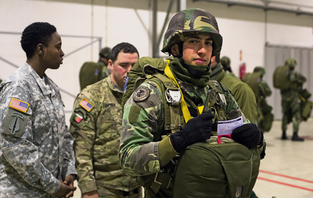U.S. Army jumpmasters inspect a Portuguese paratrooper before loading onto a C-130J Super Hercules assigned to the 37th Airlift Squadron during exercise Real Thaw 16 Feb. 22 in Beja, Portugal.
