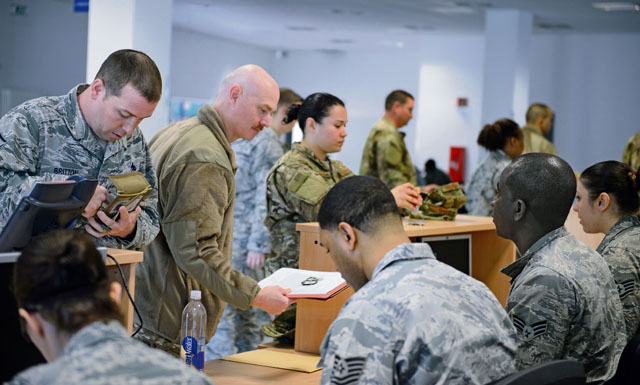 Airmen from the 435th Contingency Response Group ensure their documents are ready in preparation for a deployment April 11 on Ramstein. Airmen are required to be ready to deploy at any time to their mission.