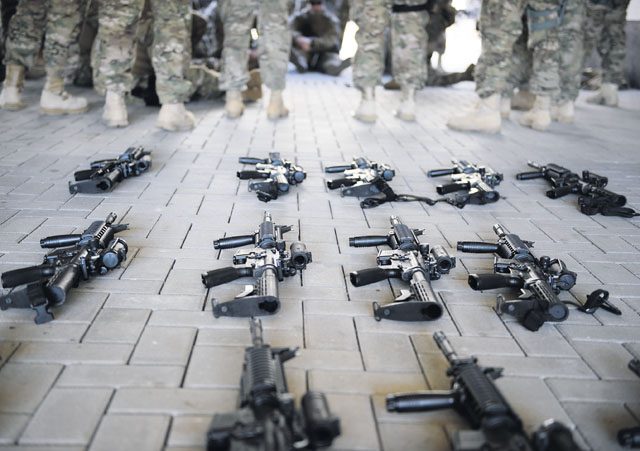 Weapons lay on the ground as Airmen wait for training to begin April 11 on Ramstein. The Airmen participated in a variety of tasks to prepare for an upcoming deployment, where they will execute one of their primary missions of building a base from the ground up.