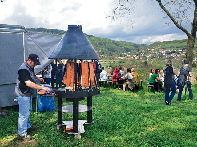 Courtesy photoVisitors of the culinary hike in Wolfstein can taste salmon from the Finish kota grill Sunday.