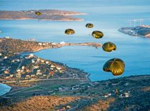 Photo by Staff Sgt. Nancy KasbergGreek paratroopers descend to the drop zone after exiting a U.S. Air Force C-130J Super Hercules during Stolen Cerberus III April 12 above Elefsis, Greece. Greek land and special operations forces were able to jump from U.S. aircraft under the supervision of a joint team of U.S. jumpmasters.  This is the third year in a row that the U.S. and Greeks have conducted exercise Stolen Cerberus.