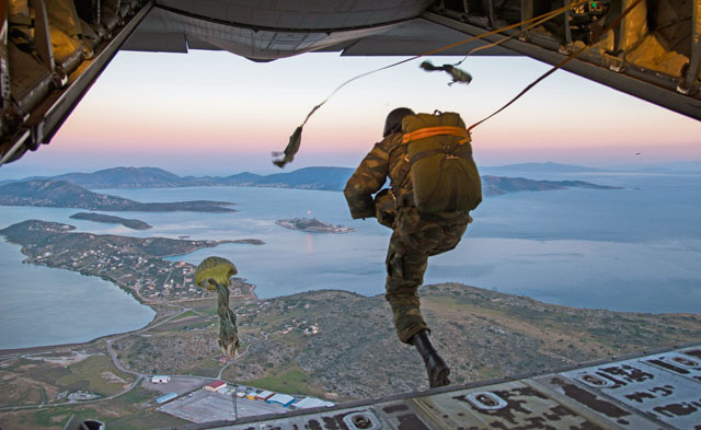 Photo by Staff Sgt. Nancy KasbergA Greek paratrooper exits a U.S. Air Force C-130J Super Hercules during Stolen Cerberus III April 12 above Elefsis, Greece. The flying-training deployment provided different training scenarios, enabling the allied services to work together and gain a better understanding of how each other operates. 