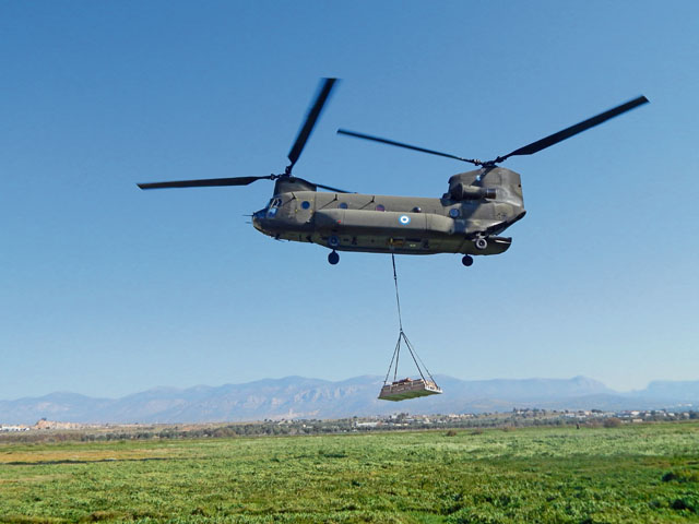 Photo courtesy of Greek air force 865th Aerial Delivery BattalionA Greek air force Chinook cargo helicopter tows a Type Five Palette System that riggers from 5th Quartermaster Theater Aerial Delivery Company and Greece's 865th Aerial Delivery Battalion hooked onto it April 5 in Elefsis, Greece.