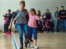 Lisa (left) and AyLeen participate in a three-legged race during a community engagement event led by Airmen from Ramstein April 23 in Landstuhl.