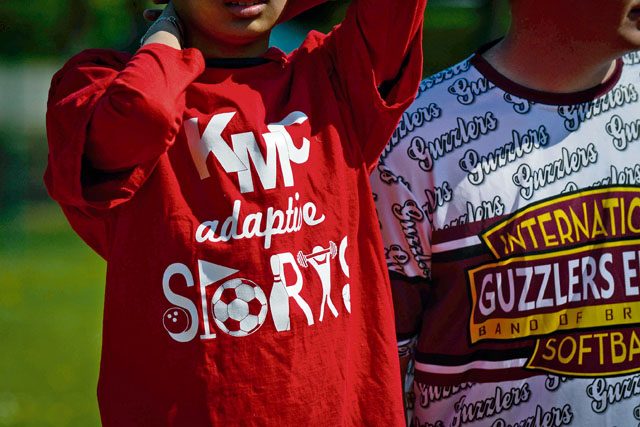 A Kaiserslautern Middle School student wears a KMC Adaptive Sports shirt May 2 on Ramstein. The student was one of more than 20 special needs kids who participated in a softball game between Kaiserslautern and Ramstein middle and high schools.