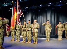 Col. Lawrence Burns, Warrior Transition Battalion-Europe commander, salutes the color guard and BHC-E company leadership during the WTB-E inactivation ceremony May 5 at the KMC Onstage Theater on Kleber Kaserne.