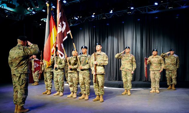 Col. Lawrence Burns, Warrior Transition Battalion-Europe commander, salutes the color guard and BHC-E company leadership during the WTB-E inactivation ceremony May 5 at the KMC Onstage Theater on Kleber Kaserne.