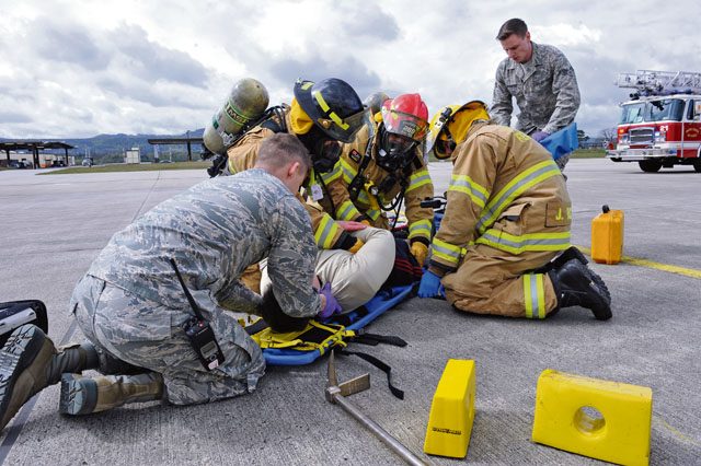 First responders prepare a simulated casualty for transport during Wing Thunder April 26 on Ramstein. Wing Thunder was an inspection to evaluate the operational readiness and response of Team Ramstein.