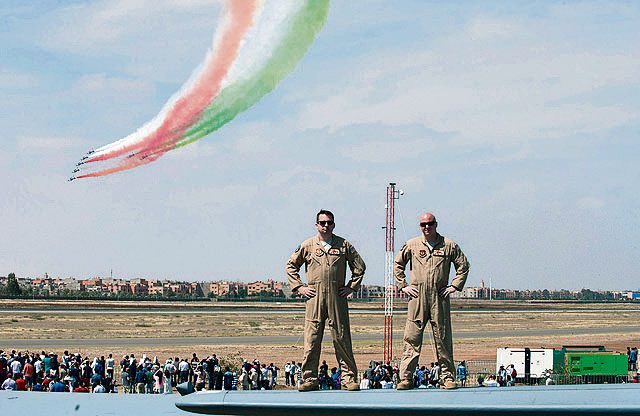 Tech. Sgt. Matthew Miller (left) and Staff Sgt. Ryan Gorby, 86th Aircraft Maintenance Squadron crew chiefs, stand on the tale of a Ramstein C-130J Hercules during the International Marrakech Air Show April 30 in Morocco. Both crew chiefs are part of a six-man flightcrew entrusted with transporting the aircraft to the air show and showcasing the aircraft’s capabilities.